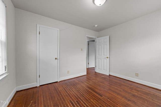 2512 Mckinney St, Burlington, NC 27217 - unfurnished bedroom with baseboards and hardwood / wood-style flooring