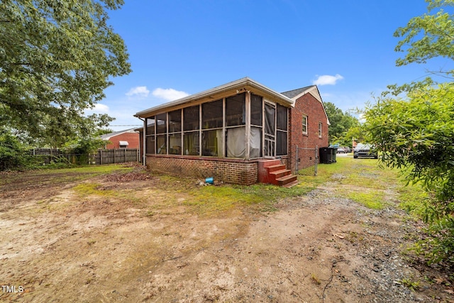 2512 Mckinney St, Burlington, NC 27217 - back of property featuring a sunroom and brick siding