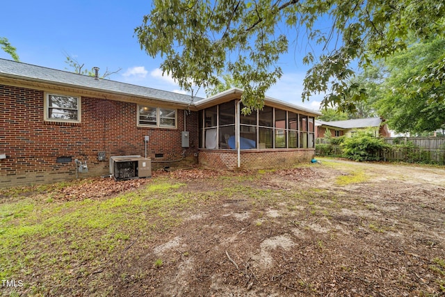 2512 Mckinney St, Burlington, NC 27217 - rear view of property featuring a sunroom, brick siding, and crawl space