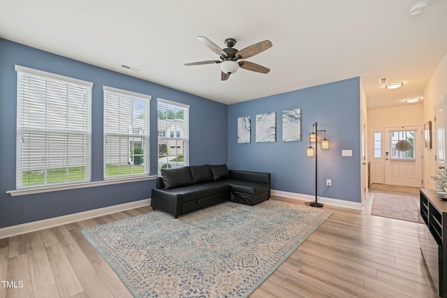 1137 Amber Shadow Dr, Durham, NC 27703 - living area with light wood-style flooring and ceiling fan