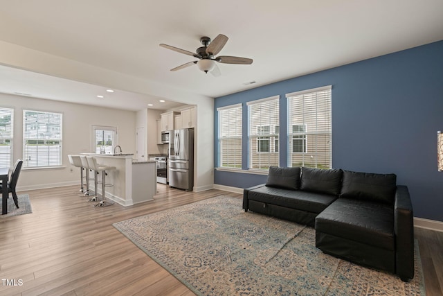 1137 Amber Shadow Dr, Durham, NC 27703 - living room featuring light wood-style flooring, a ceiling fan, and recessed lighting