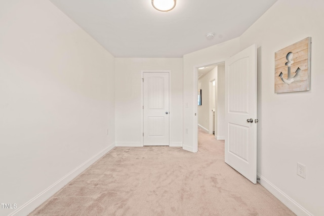 1137 Amber Shadow Dr, Durham, NC 27703 - unfurnished bedroom with light carpet and baseboards