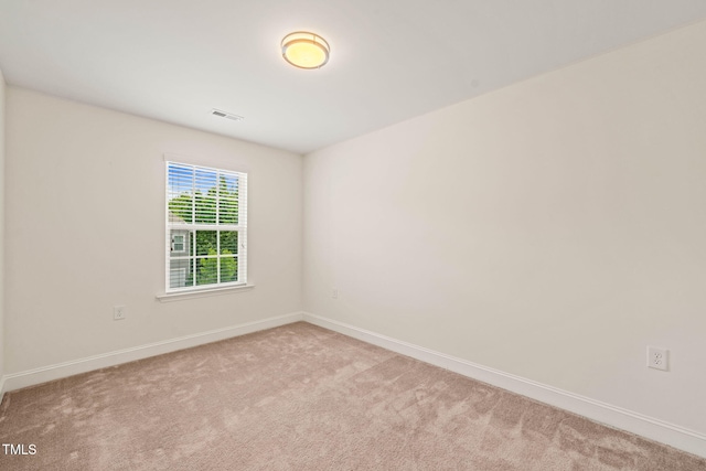 1137 Amber Shadow Dr, Durham, NC 27703 - carpeted spare room featuring baseboards