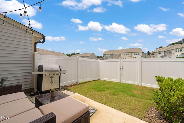 1137 Amber Shadow Dr, Durham, NC 27703 - fenced backyard with a patio, a residential view, and a gate