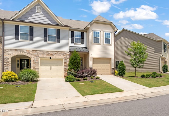 1137 Amber Shadow Dr, Durham, NC 27703 - view of front of home featuring stone siding, concrete driveway, and a front yard