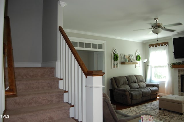 2471 Golden Forest Dr, Franklinton, NC 27525 - living room featuring ceiling fan, stairs, ornamental molding, and a fireplace
