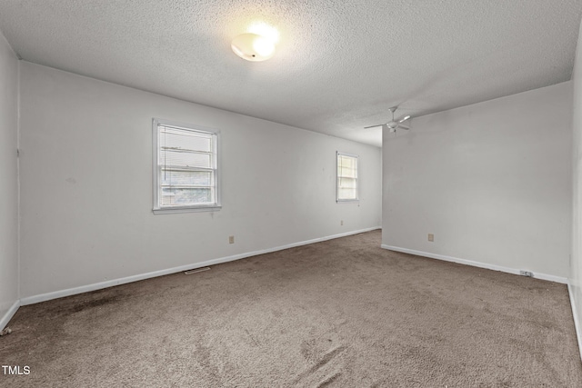 1402 Tarleton Ave, Burlington, NC 27215 - empty room with ceiling fan, a textured ceiling, and carpet flooring