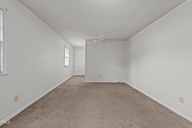 1402 Tarleton Ave, Burlington, NC 27215 - carpeted empty room with a ceiling fan and a textured ceiling