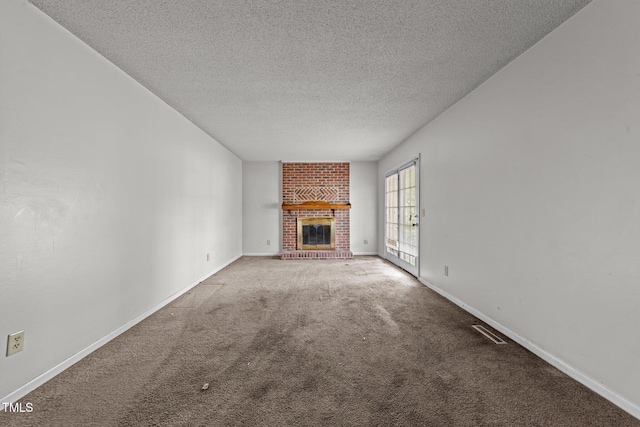 1402 Tarleton Ave, Burlington, NC 27215 - unfurnished living room with carpet flooring, a brick fireplace, and a textured ceiling