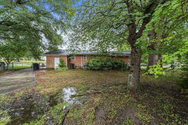1402 Tarleton Ave, Burlington, NC 27215 - back of house with concrete driveway and brick siding