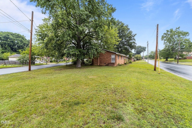 1402 Tarleton Ave, Burlington, NC 27215 - view of front of home featuring brick siding and a front yard