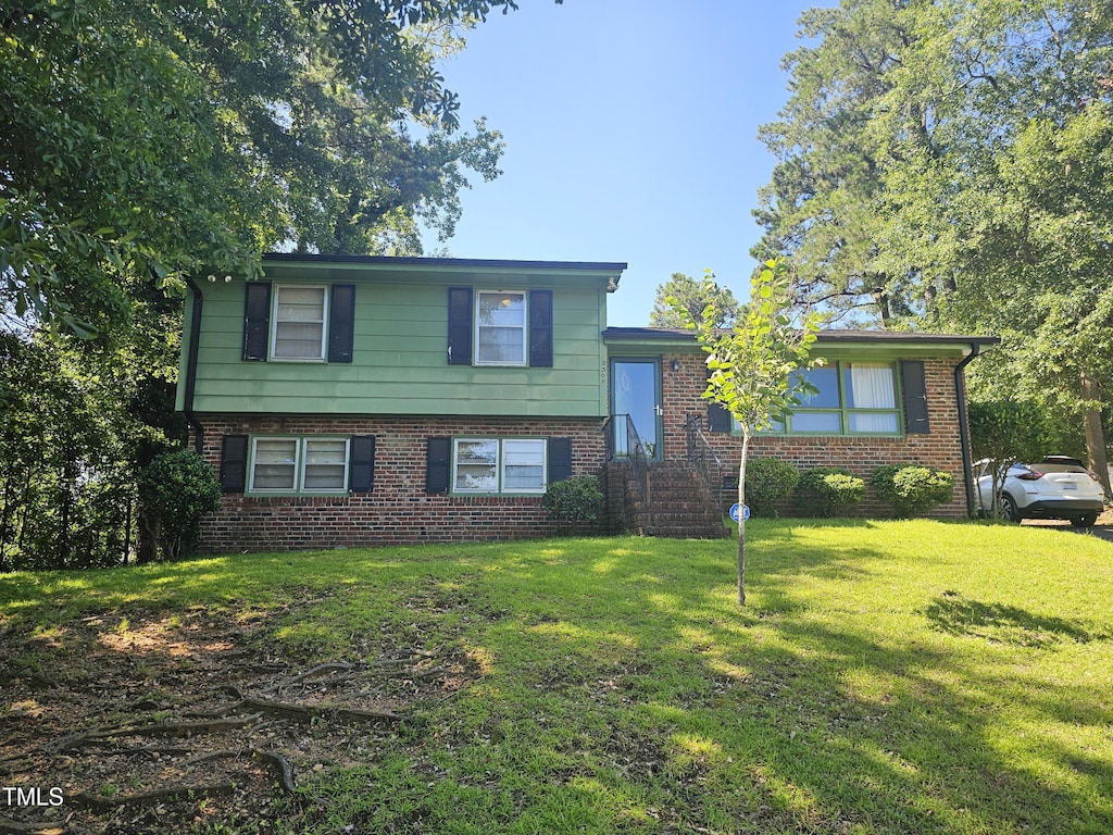 2308 Blacklan Cir, Raleigh, NC 27610 - tri-level home with brick siding and a front lawn