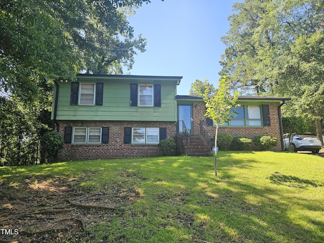 2308 Blacklan Cir, Raleigh, NC 27610 - tri-level home with brick siding and a front lawn