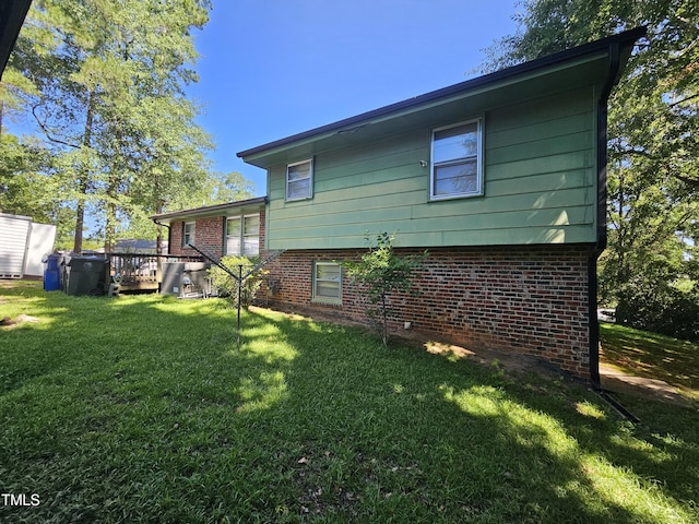 2308 Blacklan Cir, Raleigh, NC 27610 - back of house with brick siding, a yard, and a deck
