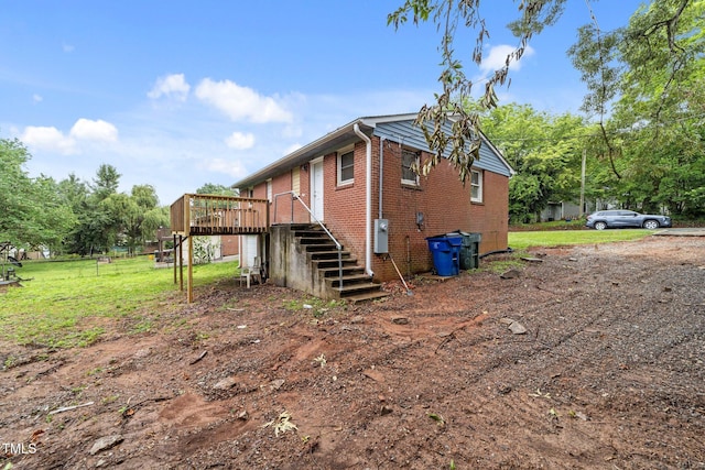 807 New St, Graham, NC 27253 - view of side of property featuring stairway, a deck, and brick siding