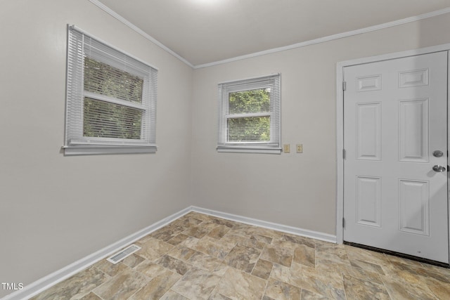 807 New St, Graham, NC 27253 - spare room featuring ornamental molding and stone finish floors