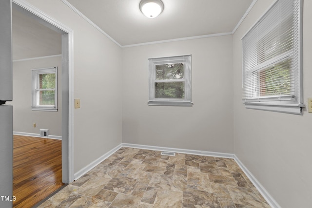 807 New St, Graham, NC 27253 - unfurnished room featuring stone finish flooring and crown molding