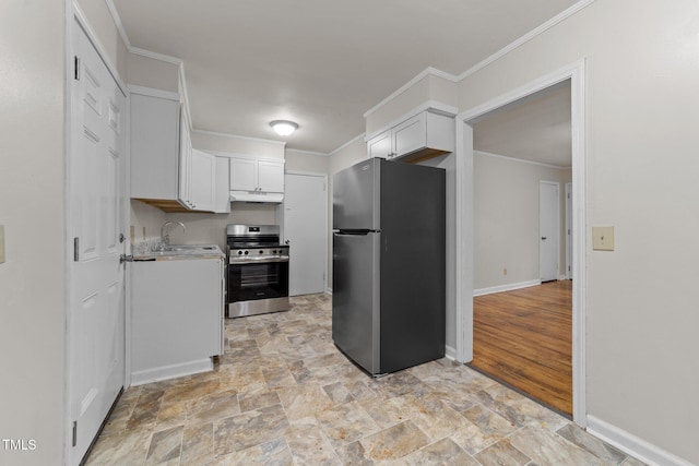 807 New St, Graham, NC 27253 - kitchen with appliances with stainless steel finishes, light stone finish floors, light countertops, white cabinetry, and under cabinet range hood