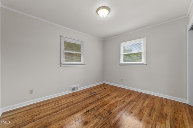 807 New St, Graham, NC 27253 - spare room with ornamental molding and wood finished floors