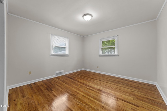 807 New St, Graham, NC 27253 - spare room featuring crown molding and wood finished floors