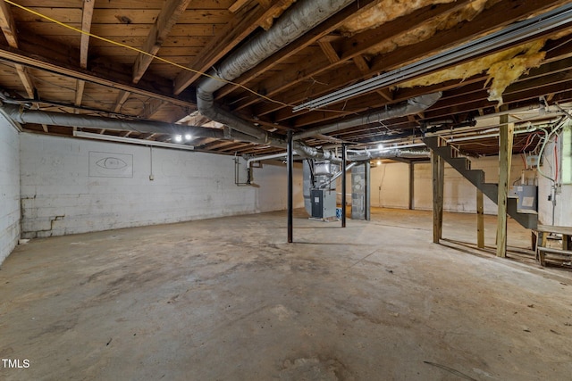 807 New St, Graham, NC 27253 - unfinished basement featuring heating unit and stairway