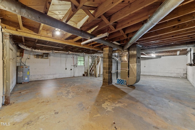 807 New St, Graham, NC 27253 - unfinished basement featuring water heater, stairway, and heating unit