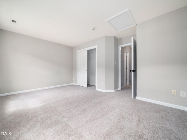 5505 Crabtree Park Ct, Raleigh, NC 27612 - unfurnished bedroom with attic access, a closet, and light colored carpet