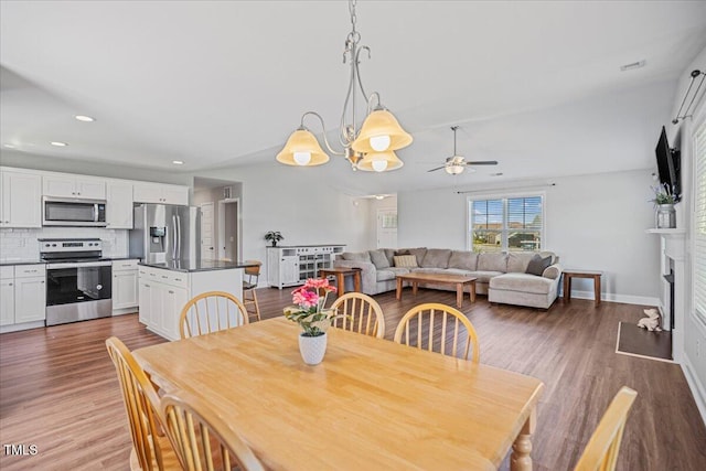 174 Arrow Ln, Middlesex, NC 27557 - dining room with ceiling fan, light wood-style flooring, recessed lighting, and a fireplace