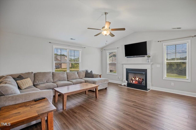 174 Arrow Ln, Middlesex, NC 27557 - living area with a ceiling fan, a lit fireplace, wood finished floors, plenty of natural light, and vaulted ceiling