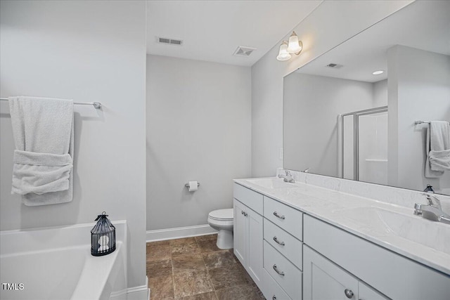 174 Arrow Ln, Middlesex, NC 27557 - bathroom featuring a bath, double vanity, a shower stall, and stone finish flooring