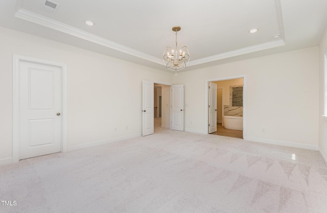 1417 Westmoreland Dr, Raleigh, NC 27612 - unfurnished bedroom with a tray ceiling, ornamental molding, a chandelier, carpet flooring, and recessed lighting