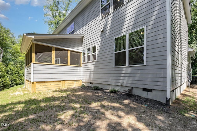 1417 Westmoreland Dr, Raleigh, NC 27612 - view of home's exterior featuring crawl space and a sunroom