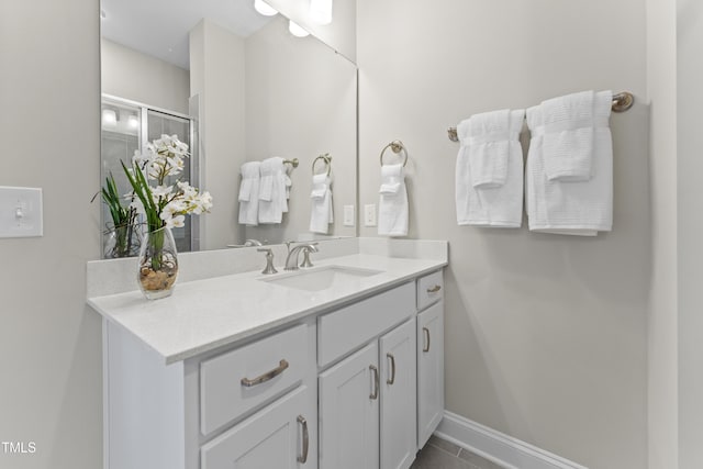 509 Kildaire Farm Rd Unit 305, Cary, NC 27511 - bathroom featuring vanity, tile patterned floors, and a shower with door