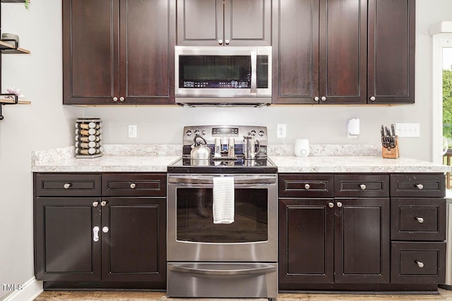 3128 Bramblegate Dr, Mebane, NC 27302 - kitchen featuring appliances with stainless steel finishes and dark brown cabinets