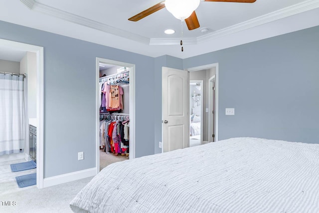 3128 Bramblegate Dr, Mebane, NC 27302 - bedroom with a walk in closet, carpet floors, crown molding, connected bathroom, and a ceiling fan
