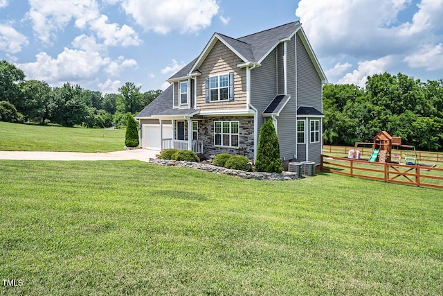 3128 Bramblegate Dr, Mebane, NC 27302 - view of front of home with a playground, stone siding, concrete driveway, an attached garage, and roof with shingles