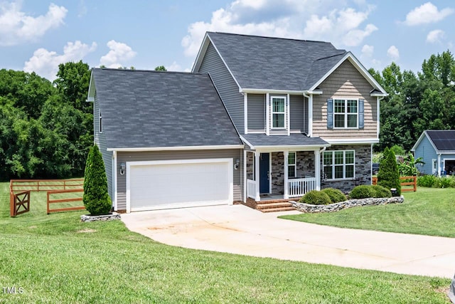 3128 Bramblegate Dr, Mebane, NC 27302 - view of front of home with a porch, driveway, an attached garage, and stone siding