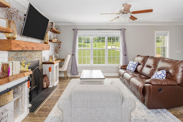 3128 Bramblegate Dr, Mebane, NC 27302 - living room with crown molding, a ceiling fan, wood finished floors, and a fireplace