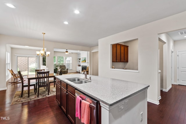 1320 Cozy Oak Ave, Cary, NC 27519 - kitchen featuring dishwasher, dark wood-style floors, a kitchen island with sink, open floor plan, and a ceiling fan