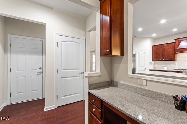 1320 Cozy Oak Ave, Cary, NC 27519 - kitchen with dark wood finished floors, recessed lighting, tasteful backsplash, light stone countertops, and stainless steel gas stovetop