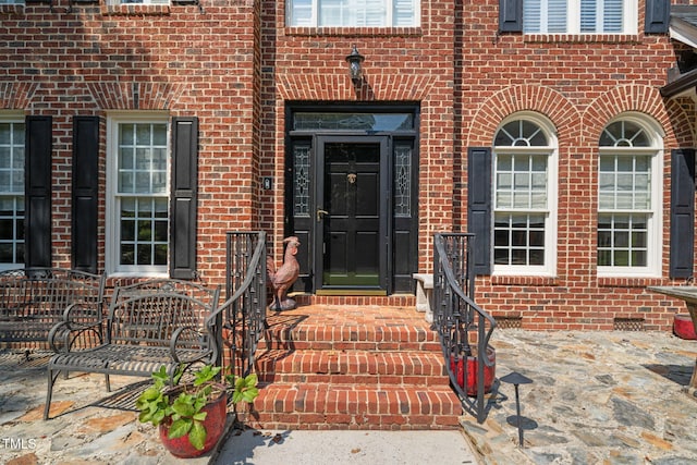 9009 Hometown Dr, Raleigh, NC 27615 - view of exterior entry with brick siding and crawl space