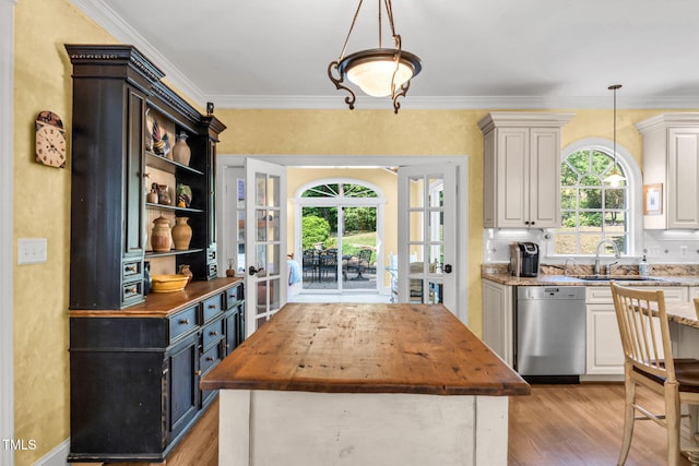 9009 Hometown Dr, Raleigh, NC 27615 - kitchen with wood counters, dishwasher, plenty of natural light, french doors, and crown molding