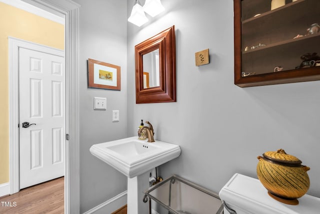 9009 Hometown Dr, Raleigh, NC 27615 - bathroom featuring wood finished floors and baseboards