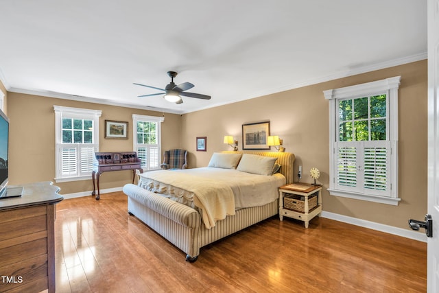 9009 Hometown Dr, Raleigh, NC 27615 - bedroom featuring crown molding, wood finished floors, and ceiling fan
