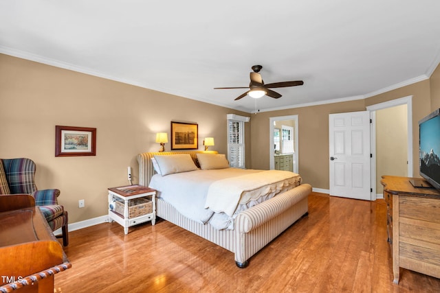 9009 Hometown Dr, Raleigh, NC 27615 - bedroom featuring light wood-type flooring, ornamental molding, ceiling fan, and ensuite bathroom