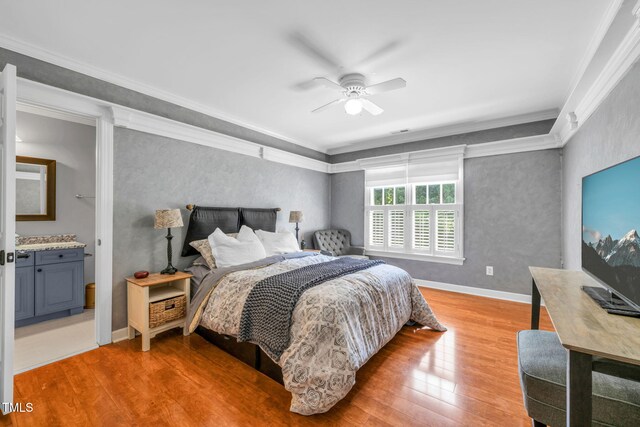 9009 Hometown Dr, Raleigh, NC 27615 - bedroom featuring light wood-style flooring, ornamental molding, a ceiling fan, and ensuite bath