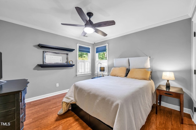 9009 Hometown Dr, Raleigh, NC 27615 - bedroom with wood finished floors, crown molding, and a ceiling fan