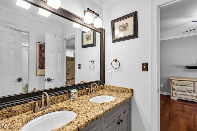 9009 Hometown Dr, Raleigh, NC 27615 - full bath featuring double vanity, ornamental molding, and wood finished floors