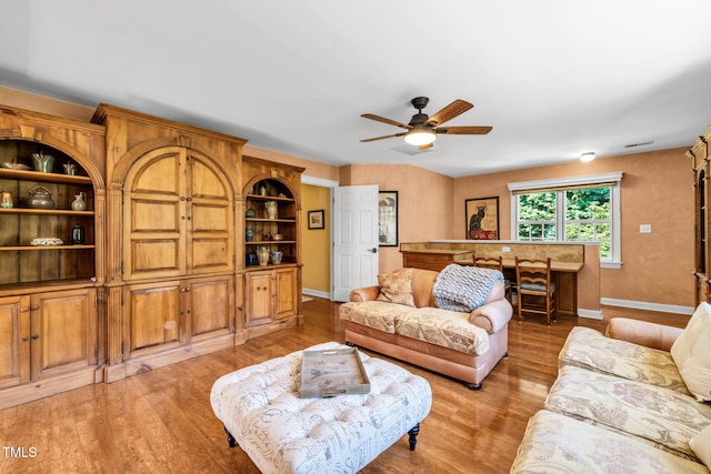 9009 Hometown Dr, Raleigh, NC 27615 - living area with a ceiling fan and light wood-type flooring