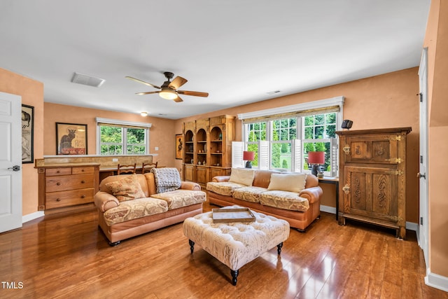 9009 Hometown Dr, Raleigh, NC 27615 - living area featuring ceiling fan and wood finished floors